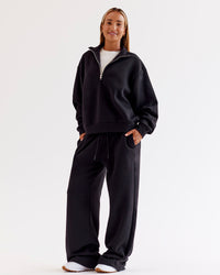 Woman wearing Go-To Oversized Quarter Zip Sweater - Black | Model:Jaimee | Size:XS | Thumbnail Index: 4
