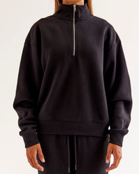 Woman wearing Go-To Oversized Quarter Zip Sweater - Black | Model:Jaimee | Size:XS | Thumbnail Index: 2
