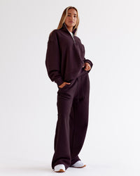 Woman wearing Go-To Oversized Quarter Zip Sweater - Midnight Plum | Model:Jaimee | Size:XS | Thumbnail Index: 1
