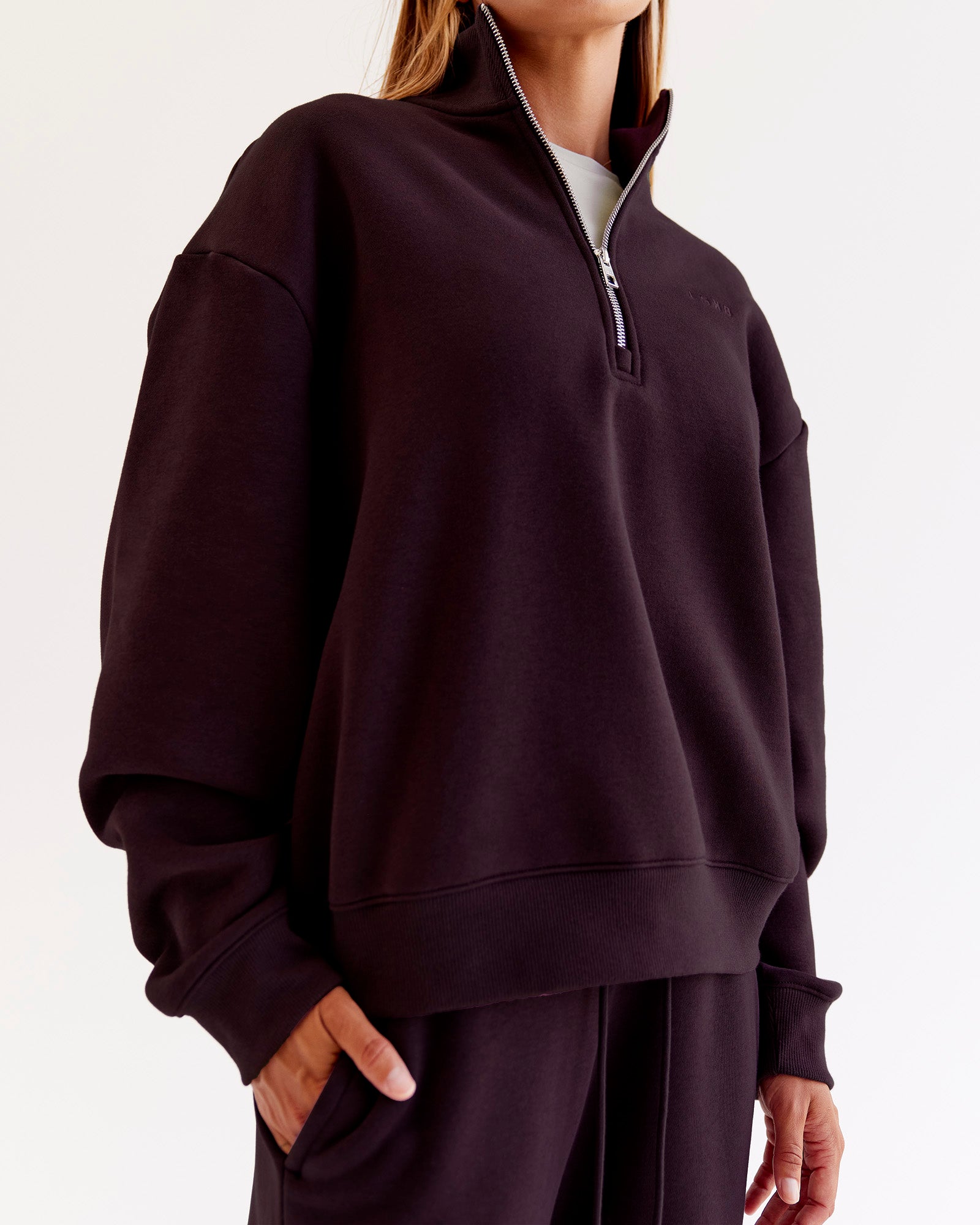 Woman wearing Go-To Oversized Quarter Zip Sweater - Midnight Plum | Model:Jaimee | Size:XS
