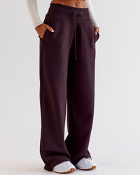 Woman wearing Go-To Wide Leg Track Pant - Midnight Plum | Model:Jaimee | Size:XS | Thumbnail Index: 0