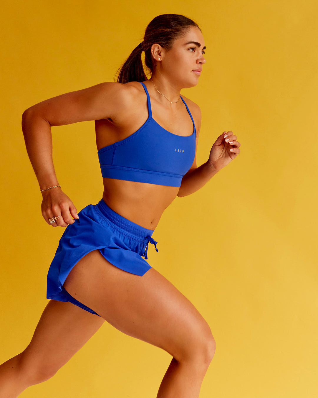 Woman wearing Lift Sports Bra - Electric Indigo | Model:Bella | Size:XS - view 1