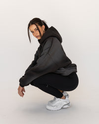 Woman wearing Memory In Motion 500gsm Ultra Heavyweight Washed Hoodie - Charcoal Washed | Model:Eliza | Size:XS | Thumbnail Index: 4
