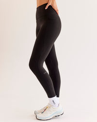 Woman wearing O.G Fusion Ultra High-Rise Full Length Legging Pockets - Black | Model:Taneisha | Size:XS | Thumbnail Index: 1