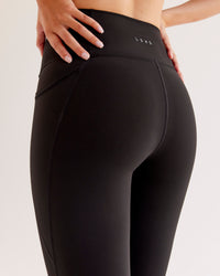 Woman wearing O.G Fusion Ultra High-Rise Full Length Legging Pockets - Black | Model:Taneisha | Size:XS | Thumbnail Index: 4
