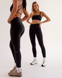 Woman wearing O.G Fusion Ultra High-Rise Full Length Legging Pockets - Black | Model:Taneisha | Size:XS | Thumbnail Index: 2