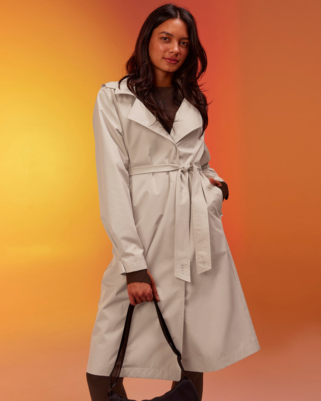 Woman wearing On the Move Trench Coat - Shale Beige | Model:Alex | Size:XS - view 2