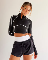 Woman wearing Power Quarter Zip Jacket - Black | Model:Charli | Size:XS | Thumbnail Index: 3