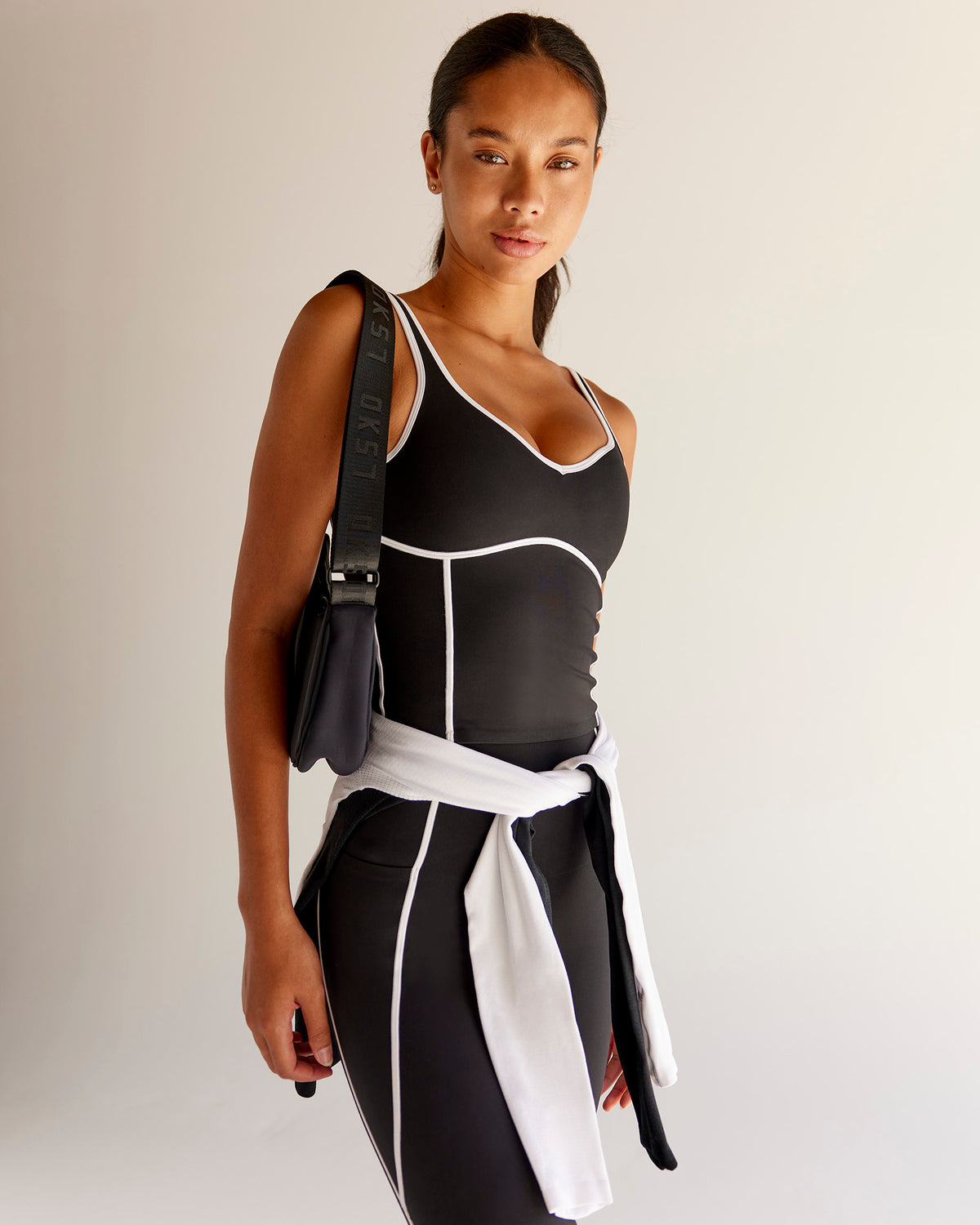 Woman wearing Power Sweetheart Shelf Bra Tank - Black | Model:Tali | Size:XS