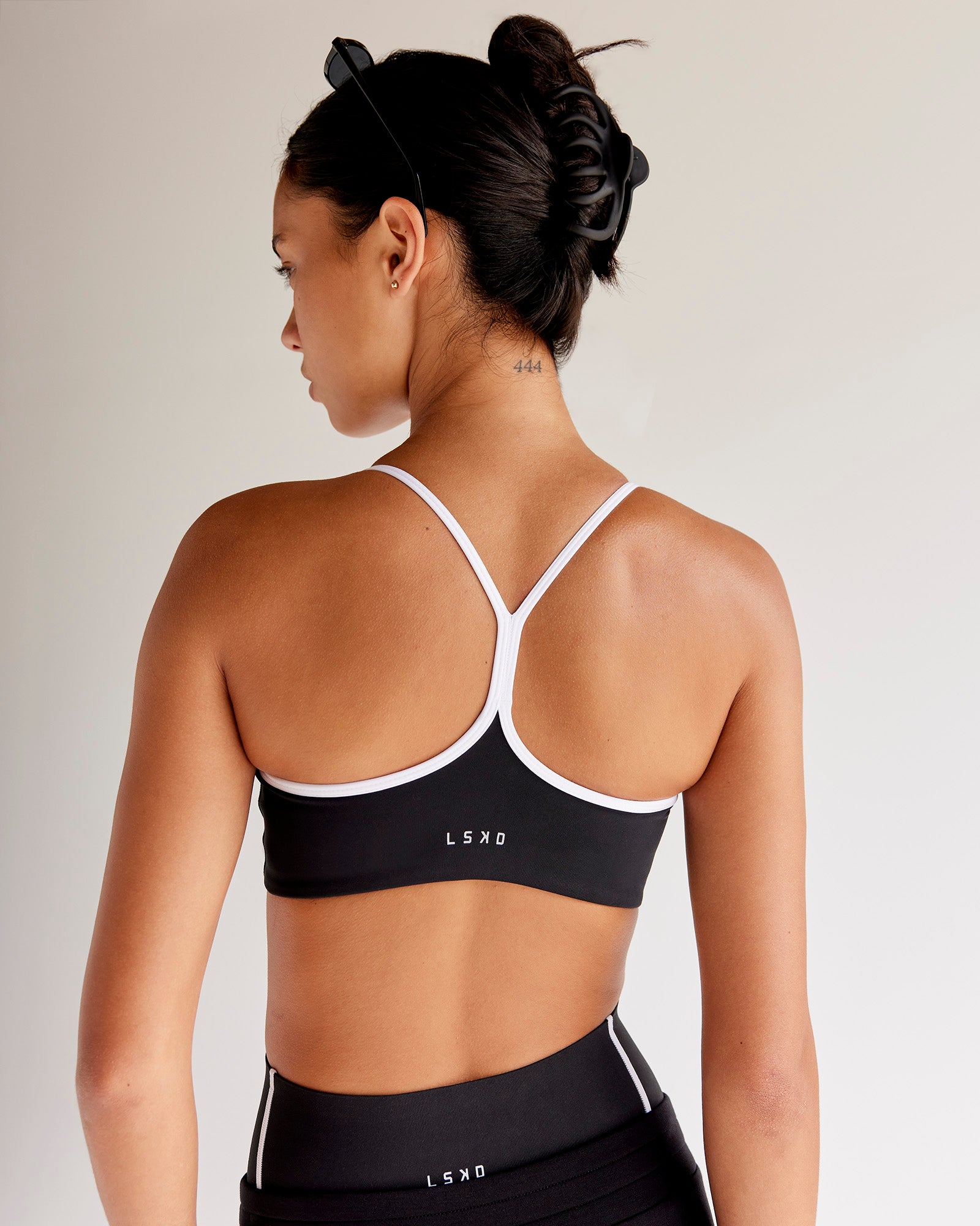 Woman wearing Power Sweetheart Sports Bra - Black | Model:Tali | Size:XS