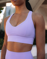 Woman wearing Sculpt Sports Bra - Violet Ray | Model:Txai | Size:XS | Thumbnail Index: 0
