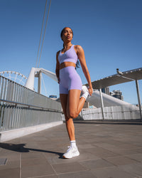 Woman wearing Sculpt Sports Bra - Violet Ray | Model:Txai | Size:XS | Thumbnail Index: 4