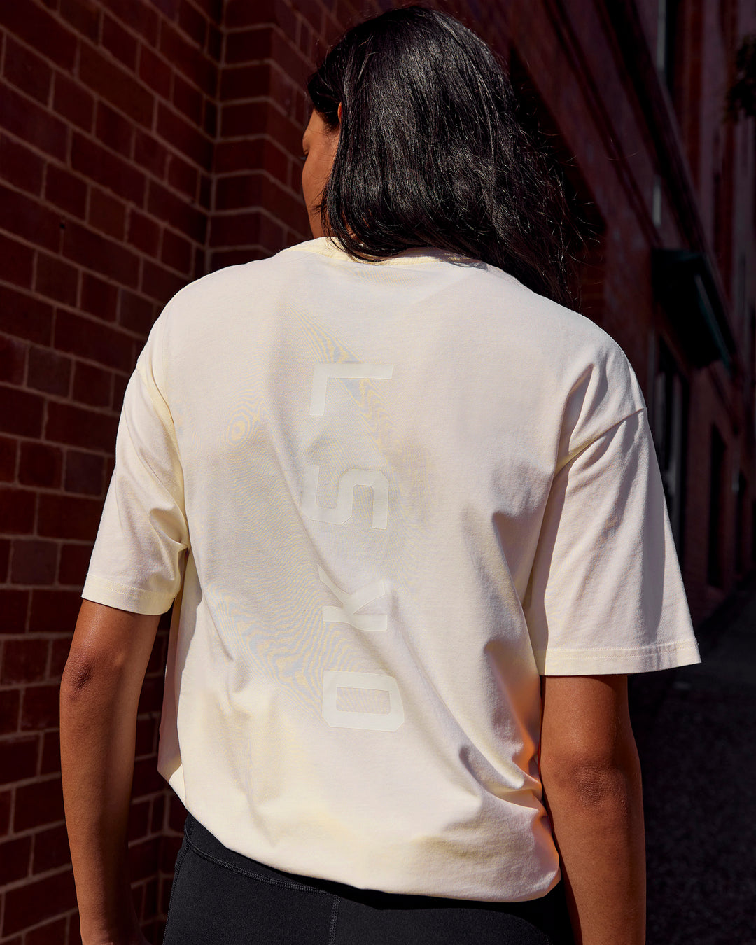 Woman wearing Shadow Mode FLXCotton Oversized Tee - Off White Washed | Model:Alex | Size:XS - view 2