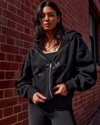 Woman wearing Shadow Mode Oversized Zip Through Hoodie - Black | Model:Alex | Size:XS | Thumbnail Index: 1