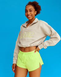Woman wearing Slam Quarter Zip Sweater - Shale Beige-Lime Glo | Model:Txai | Size:XS | Thumbnail Index: 0