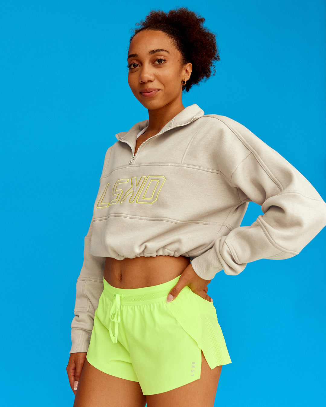 Woman wearing Slam Quarter Zip Sweater - Shale Beige-Lime Glo | Model:Txai | Size:XS - view 4