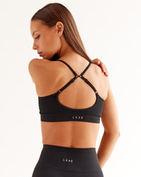 Woman wearing Spark Seamless Sports Bra - Black | Model:Brylee | Size:XS | Thumbnail Index: 0
