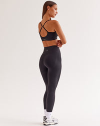 Woman wearing Surge Seamless High-Rise Full Length Legging - Black | Model:Brylee | Size:XS | Thumbnail Index: 0