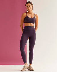 Woman wearing Twist Sports Bra - Midnight Plum | Model:Bruna | Size:XS | Thumbnail Index: 4