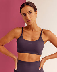 Woman wearing Twist Sports Bra - Midnight Plum | Model:Bruna | Size:XS | Thumbnail Index: 3