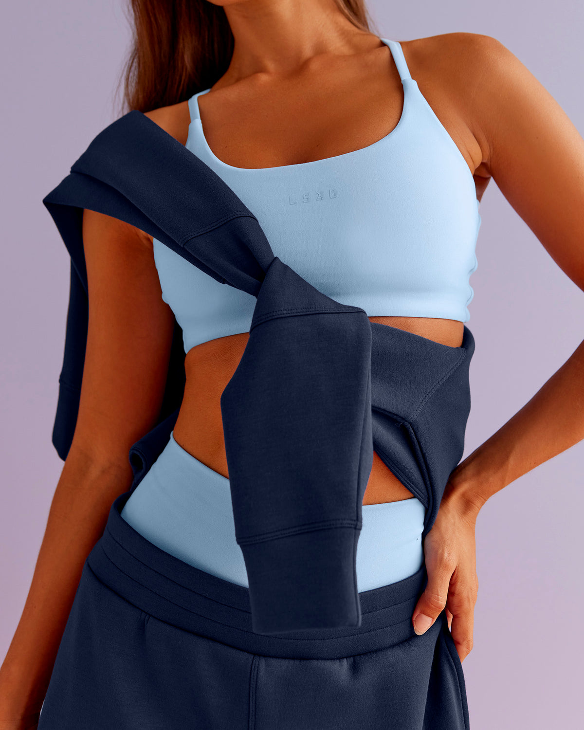 Woman wearing Twist Sports Bra - Open Air | Model:Brylee | Size:XS