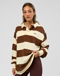 Woman wearing Clubhouse Unisex Polo - Off White-Brown | Model:Georgia| Size:XS | Thumbnail Index: 5