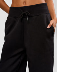 Woman wearing Go-To Wide Leg Track Pant Tall - Black | Model:Georgia | Size:XS | Thumbnail Index: 3