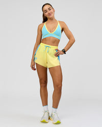 Woman wearing Breeze Sports Bra - Baltic Sea-Lemon | Model:Grace | Size:XS | Thumbnail Index: 4