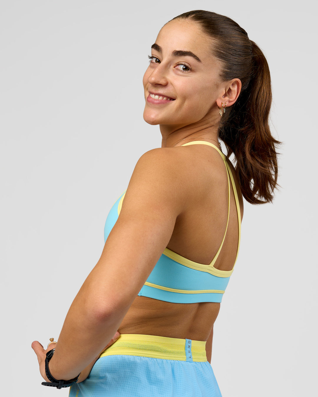 Woman wearing Breeze Sports Bra - Baltic Sea-Lemon | Model:Grace | Size:XS - view 10