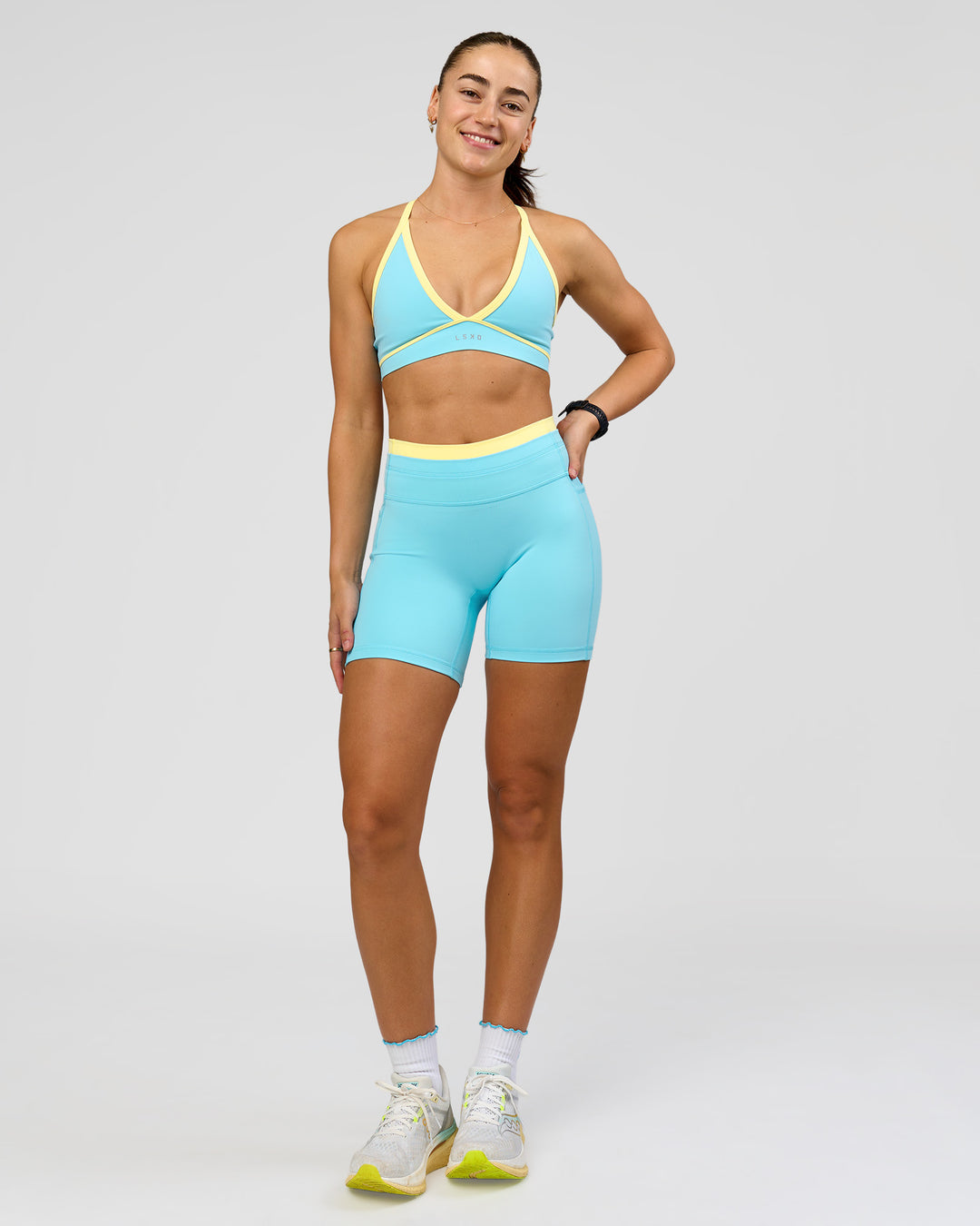 Woman wearing Breeze Sports Bra - Baltic Sea-Lemon | Model:Grace | Size:XS - view 12
