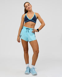 Woman wearing Breeze Sports Bra - Future Navy-Baltic Sea | Model:Grace | Size:XS | Thumbnail Index: 1