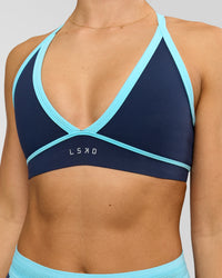 Woman wearing Breeze Sports Bra - Future Navy-Baltic Sea | Model:Grace | Size:XS | Thumbnail Index: 2