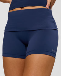 Woman wearing Groovy High Rise Fold Over 4" Short - Future Navy | Model:Grace | Size:XS | Thumbnail Index: 1