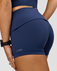 Woman wearing Groovy High Rise Fold Over 4" Short - Future Navy | Model:Grace | Size:XS | Thumbnail Index: 4