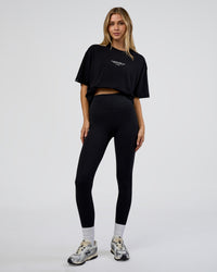 Woman wearing 1% Better Every Day EST FLXCotton Oversized Tee - Black | Model:Leilani | Size:XS | Thumbnail Index: 2