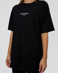Woman wearing 1% Better Every Day EST FLXCotton Oversized Tee - Black | Model:Leilani | Size:XS | Thumbnail Index: 8
