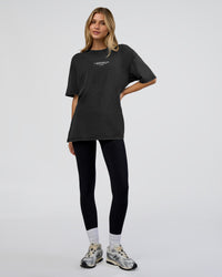 Woman wearing 1% Better Every Day EST FLXCotton Oversized Tee - Black Washed | Model:Leilani | Size:XS | Thumbnail Index: 4