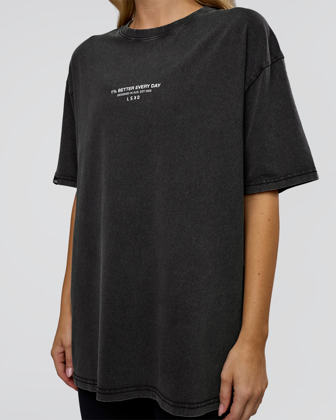 Woman wearing 1% Better Every Day EST FLXCotton Oversized Tee - Black Washed | Model:Leilani | Size:XS - view 9