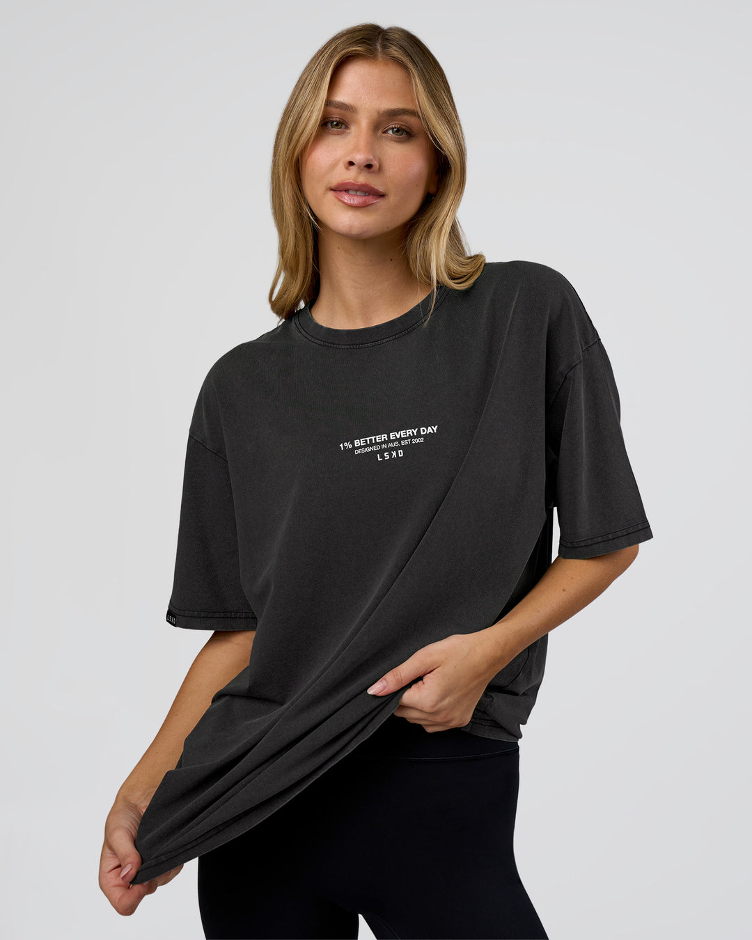 Woman wearing 1% Better Every Day EST FLXCotton Oversized Tee - Black Washed | Model:Leilani | Size:XS - view 4