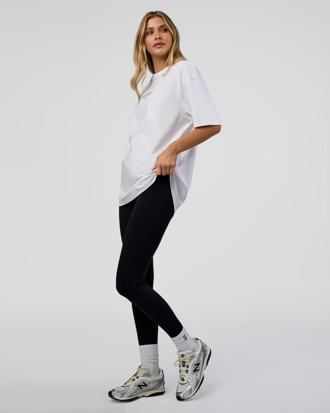 Woman wearing 1% Better Every Day EST FLXCotton Oversized Tee - White | Model:Leilani | Size:XS - view 5