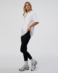 Woman wearing 1% Better Every Day EST FLXCotton Oversized Tee - White | Model:Leilani | Size:XS | Thumbnail Index: 4