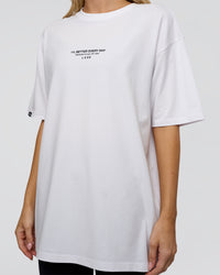 Woman wearing 1% Better Every Day EST FLXCotton Oversized Tee - White | Model:Leilani | Size:XS | Thumbnail Index: 8