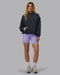 Woman wearing 1% Better Value Series Oversized Hoodie - Black-Violet Ray | Model:Emilie | Size:XS | Thumbnail Index: 9
