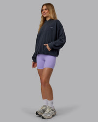 Woman wearing 1% Better Value Series Oversized Hoodie - Black-Violet Ray | Model:Emilie | Size:XS | Thumbnail Index: 5