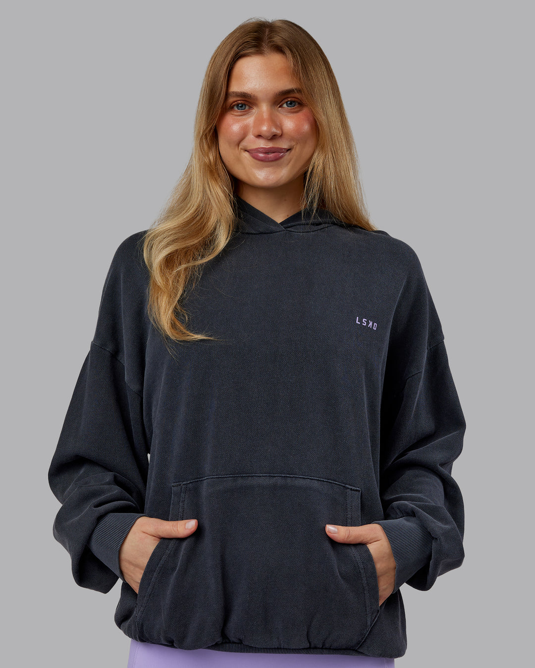 Woman wearing 1% Better Value Series Oversized Hoodie - Black-Violet Ray | Model:Emilie | Size:XS - view 4