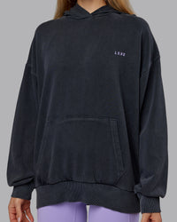 Woman wearing 1% Better Value Series Oversized Hoodie - Black-Violet Ray | Model:Emilie | Size:XS | Thumbnail Index: 8