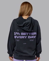 Woman wearing 1% Better Value Series Oversized Hoodie - Black-Violet Ray | Model:Emilie | Size:XS | Thumbnail Index: 1