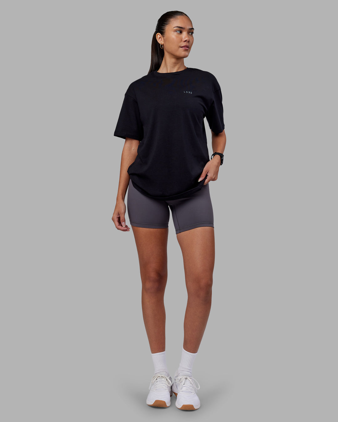 Woman wearing 1% Better Value Series FLXCotton Tee Oversize - Black-Black | Model:Rhiley | Size:XS - view 10