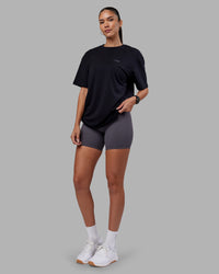 Woman wearing 1% Better Value Series FLXCotton Tee Oversize - Black-Black | Model:Rhiley | Size:XS | Thumbnail Index: 5