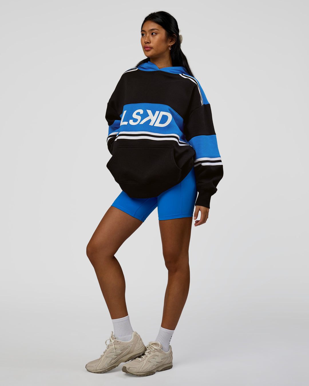 Woman wearing A-Team Oversized Hoodie - Caviar-Palace Blue | Model:Loren | Size:XS - view 13